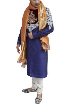 Blue sherwani with hand leaf work bodice.
Components: 1
Neckline: Mandarin collar
Sleeve Length: Full sleeves
Fabric: Raw Silk
Color: Blue
Zardozi embroidery
Note: The churidar and stole  worn by the model are not for sale. - Aza Fashions Royal Festive Wedding Kurta, Traditional Blue Sherwani With Pallu, Royal Sherwani With Zari Work For Festive Occasions, Blue Semi-stitched Sherwani For Diwali, Royal Festive Sherwani With Zari Work, Royal Kurta For Eid Wedding, Royal Kurta For Wedding And Eid, Royal Bandhgala For Eid, Royal Festive Kurta For Eid