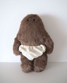 a brown teddy bear wearing a diaper