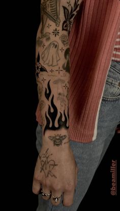 a man's arm with tattoos on it