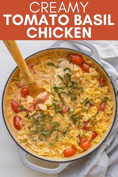 creamy tomato basil chicken in a skillet with a wooden spoon on the side and text overlay