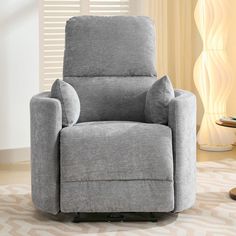 a gray recliner chair in a living room