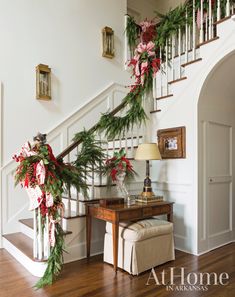 christmas decorations on the banister and stairs in a home