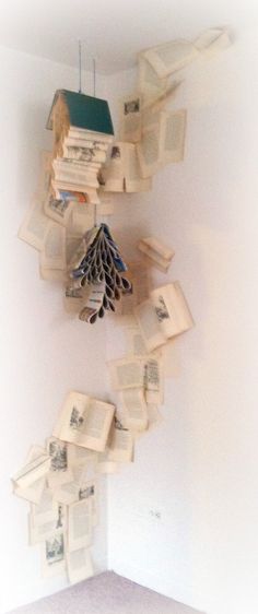 an upside down book sculpture made out of old books