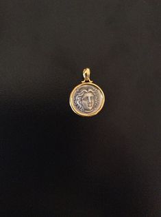 "Apollo-Helios  Coin Pendant sterling silver 925 & gold plated k 14 Best Gift Ideas.Handmade The famous tetradrachms of Rhodos bear a depiction of the head ,identified with Apollo,which is the main numismatic type on Rhodian coins .The representation of the rose on the reverse is a \"punning representation''of the name of the city (rose, in Greek rhodom),which was famous for its roses, after which it was named. ◆ Gender : Male / Famale ◆ Materiel :925 Sterling Silver ◆ Pendant Diameter : 2.00cm x 2.00 cm (0.8x 0.8 inc)" Symbolic Gold Jewelry Stamped 925, Gold Medallion Necklace Stamped 925, Gold Medallion Necklaces Stamped 925, Gift Ideas Handmade, Ideas Handmade, Best Gift Ideas, Coin Pendant, Best Gift, Sterling Silver Pendants