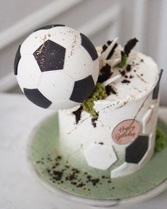 a soccer ball on top of a cake