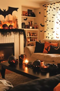 a living room decorated for halloween with pumpkins and bats