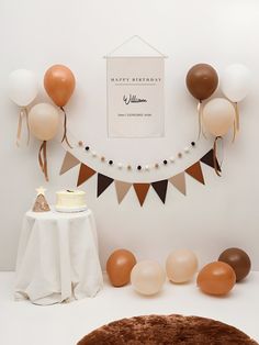 a birthday party with balloons, cake and decorations