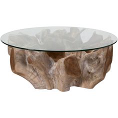 a glass and wood coffee table with an animal's head on it, against a white background