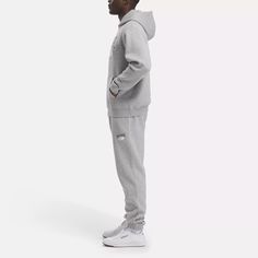 This Reebok sweatshirt has vintage-inspired Reebok wording and a capsule Vector logo for a retro look. The drop shoulders make it roomy, so you can move around comfortably. Casual Logo Print Sweats For Streetwear, Graphic Print Sweats For Casual Wear, Letter Print Sweats For Streetwear, Graphic Print Tracksuit For Streetwear Athleisure, Sportswear Hoodie Sweats For Leisure, Sportswear Sweats Hoodie For Leisure, Athleisure Tracksuit With Graphic Print For Streetwear, Leisure Sportswear Hoodie Sweats, Leisure Sportswear Sweats Hoodie