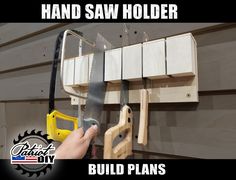 a hand saw holder is hanging on a wall with tools attached to it and the words build plans below