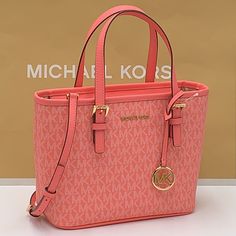 Michael Kors Xs Convertible Top Zip Tote Grapefruit Color: Grapefruit Michael Kors Jet Set Travel Xs Top Zip Convertible Tote/Satchel/Crossbody Pvc/Leather Gold Tone Hardware Crossbody Strap 22” Drop Exterior: 1 Back Slip Pocket Interior: 1 Zipper Pocket/2 Slip Pockets 7.62”H X 4”W X 9” L (Bottom) Does Not Include Dust Bag Brand New With Tag Bag Logo, Luxury Bags Collection, Bags Michael Kors, Michael Kors Crossbody Bag, Girly Bags, Leather Duffle, Convertible Top, Black Leather Crossbody Bag, Zip Tote