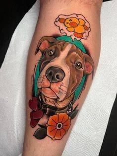 a dog with flowers on it's leg is shown in this tattoo style photo