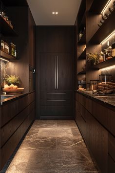 a kitchen with dark wood cabinets and counter tops