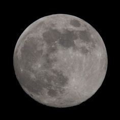 the full moon is seen in the dark sky