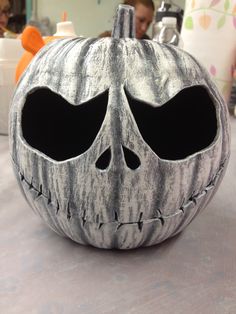 a close up of a pumpkin shaped like a skull