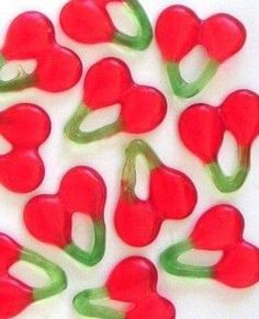 some red and green peppers on a white surface