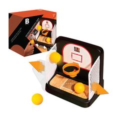 an interactive basketball game is shown in front of a box with three oranges on it