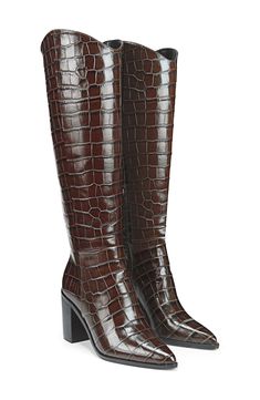 A curved topline creates a Western-inspired aesthetic on a knee-high boot balanced by a pointy toe and stacked block heel. 3 1/2" heel (size 8.5) 14" shaft, 14 1/2" circumference Side zip closure Cushioned footbed with arch support Leather upper/synthetic lining and sole Made in Brazil Chic Tall Brown Heeled Boots, Formal Brown Tall Knee-high Boots, Formal Tall Boots With Block Heel, Tall Block Heel Boots For Formal Occasions, Formal Tall Boots With Stacked Heel, Formal Knee-high Platform Boots With Stacked Heel, Tall Heeled Boots With Reinforced Heel, Knee-high Stacked Heel Boots For Work, Formal Knee-high Heeled Boots With Stacked Heel