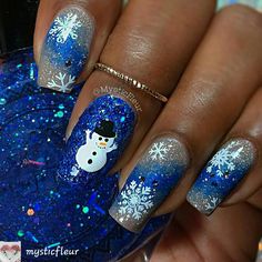 By #mysticfleur #xmasnailart #prettynailart #christmasnails #snowman#naildesigns#winternails #holidaynails#nailartist#naildesign #nailinspiration #nailartdesigns #nailartideas #nailworld #nailpictures #naturalnails Hanukkah Nail Art, Blue Snowman Nails, Xmas Nails Blue, Blue And Silver Christmas Nails, Christmas Nail Designs Blue, Winter Nail Art Snowflakes, Snowman Nails Design, Snow Nail Designs, Snow Flake Nail Art