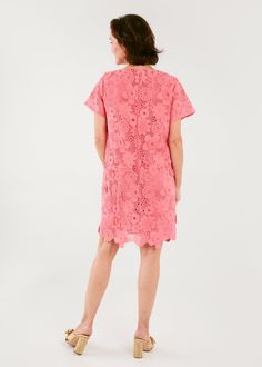 If you love an easy shift dress in an eye-catching fabric, you'll love the Lulu. This new and improved 3-D lace style nods to a caftan style but is tailored and lined like a classic cocktail dress. This dress screams spring in carnation pink and is the perfect piece to throw on for lunch with friends or wear to a warm-weather wedding. Sizing: Generous fit. We recommend sizing down if you are in between sizes. Make: Short Sleeve V-Neckline Back zipper closure Fully lined Measurements: Length from Midi Dress With Cutwork Hem And Short Sleeves, Scalloped Lace Dress For Daywear, Knee-length Dress With Cutwork Hem For Daywear, Spring Sheath Lace Dress With Scalloped Lace, Knee-length Lace Dress With Cutwork Hem, Feminine Dress With Cutwork Hem, Short Sleeve Lace Dress With Scalloped Lace For Daywear, Elegant Mini Dress With Cutwork Hem For Daywear, Elegant Daytime Mini Dress With Cutwork Hem