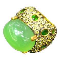 Natural Green Penite  - 12 Carat Chrome Dioxide - 3 Carat Peridot - 2 Carat  This Ring is from the "Orient" traveling collection are the epitome of elegance and versatility. It offers a perfect blend of day to night and swimwear to evening wear, allowing you to effortlessly transition between different occasions and outfits. Wearing these spectacular oriental-style ring will undoubtedly make you the center of attention. It addw a touch of glamour and sophistication to your favorite caftans, swim Luxury Peridot Multi-stone Rings, Luxury Multi-stone Peridot Ring, Unique Green Gemstones For Formal Occasions, Luxury Green Rings With Gemstone Accents, Green Stone Fine Jewelry Rings, Fine Jewelry Green Rings With Stones, Multi Gem Ring, Sapphire Cocktail Ring, Green Cocktail