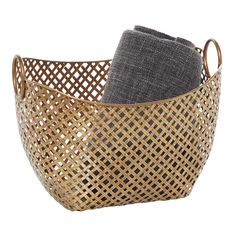 a basket with two towels in it and one folded up on the side, sitting next to each other