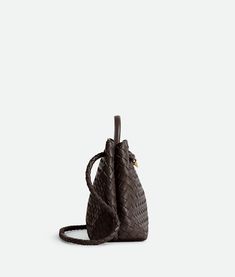 Find BOTTEGA VENETA Intrecciato Leather Top Handle Bag on Editorialist. The Bottega Veneta Intrecciato Leather Top Handle Bag features a sliding cross-body strap. The interior is compartmented with one zippered pocket and two open pockets. It has a magnetic closure, a lambskin bonded Intrecciato lining, and brass finish hardware. Dimensions: Height: 25 cm | 9.8”. Width: 32 cm | 12.6”. Depth: 11 cm | 4.3”. Handle drop: 9 cm | 3.5”. Strap drop: 45 cm | 17.7”. It is crafted from lambskin. Bottega Veneta Intrecciato, Eyewear Womens, Handle Bag, Medium Bags, Nappa Leather, Leather Top, Brass Finish, Magnetic Closure, Womens Tote Bags