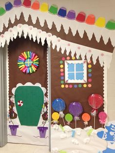 a gingerbread house decorated with candy and decorations