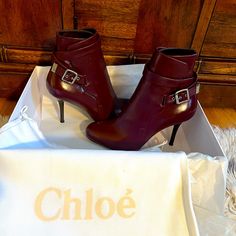 New Unworn Leather Chloe Booties. They Are A Rich Burgundy/Purple Color In Size 38.5 With A Heel Height Of Approximately 3.5 Inches And An Ankle Circumference Of Approximately 9 Inches. Very Chic And Stylish!!! They Will Be Shipped In The Original Shoe Box With The Original Shoe Dust Bag. Chic Booties With Buckle Closure And Medium Width, Chic Boots With Heel Strap And Round Toe, Chic Ankle Strap Boots With Padded Heel, Elegant Ankle Booties With Buckle Closure, Chic Ankle Strap Boots, Chic Purple Pointed Toe Boots, Chic Formal Booties With Buckle Closure, Elegant Ankle-high Burgundy Heels, Elegant Burgundy Ankle Boot Heels