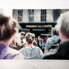 a group of people standing around each other