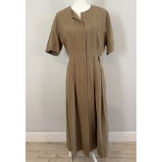 This Jenni Kayne Dress Is A Must-Have For Any Wardrobe. Made Of 100% Linen, This Day Dress Features A Solid Pattern In A Beautiful Khaki Brown Color. The Short Sleeve Shirt Dress Has A Button Closure And A Maxi Length, Making It Perfect For Any Occasion, Whether It Be Casual, Business, Party, Or Travel. The Dress Also Includes A Pocket And Is Machine Washable For Easy Care. It's A Classic Designer Piece That Will Never Go Out Of Style And Is Suitable For Women Of All Sizes. Excellent Condition, Brand Label Has Been Cut Out (See Pic), No Stains, Rips, Or Holes. Bust - 34 In Waist - 27 In Msrp - $395 Fitted Linen Dress With Button Closure And Short Sleeves, Spring Daywear Linen Dress With Button Closure, Khaki Collared Dress For Daywear, Khaki Short Sleeve Dresses With Buttons, Classic Summer Dress With Covered Buttons, Fitted Khaki Dress With Buttons, Casual Fitted Linen Dress With Button Closure, Fitted Linen Casual Dress With Button Closure, Fitted Casual Linen Dress With Button Closure