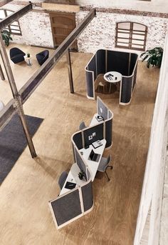 an office with multiple cubicles on the floor