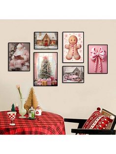 a dining room table with christmas decorations and pictures on the wall above it, including a teddy bear