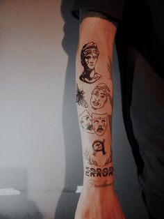 a person's arm with tattoos on it