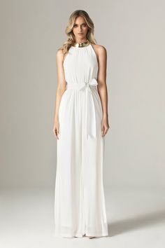 Feminine, floaty and perfect for Spring. Cut from breezy georgette chiffon for a fresh feel in elegant ivory, 'Fadia’ has a wide belt to cinch the waist . The classic halter shape silhouette and accentuates the figure whilst prioritizing luxurious comfort. and we love how the pleated waist falls to a flared long hem for feminine flair.It's fully lined for comfort and zips up the back for easy on. Wear yours with delicate accessories like our 'Adrien' necklace.WHERE TO WEAR:Pretty date nights, bo Elegant Chiffon Belted Dresses, Elegant Belted Chiffon Dresses, Summer Formal Chiffon Jumpsuits And Rompers, Elegant Evening Jumpsuit With Tie Back, Elegant Sleeveless Jumpsuit For Bridesmaids, Elegant Sleeveless Jumpsuits And Rompers For Bridesmaids, Elegant Summer Wedding Jumpsuits And Rompers, Chic Fitted Chiffon Jumpsuit, Elegant Summer Bridesmaid Jumpsuits And Rompers