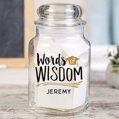 a glass jar that has words on it