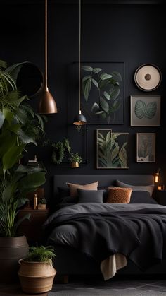 a bedroom with black walls, plants and pictures on the wall