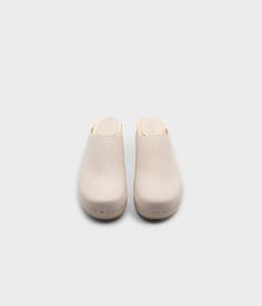 Elevate your everyday style with our minimalist clog mule, featuring clean lines and a timeless aesthetic that effortlessly transitions from day to night. Clog measurements:Heel height: 1 3/4” (4.5 cm)Toe height: 1 5/8″ (4.1 cm) Fit:RegularLeather:Nubuck leather Clogs consist of:Base: European Lime Wood Sole: Rubber sole Fastening: Staples Cork Sandals, Wooden Clogs, Timeless Aesthetic, Clog Sandals, Leather Clogs, Day To Night, To Night, Nubuck Leather, Boot Shop