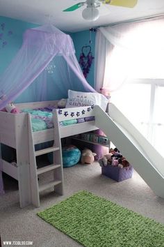 a child's bedroom with a bed and slide