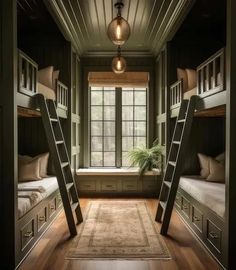 two bunk beds with ladders are in the middle of a room that has wood floors and windows