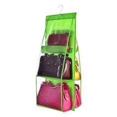 a green hanging organizer with four bags and purses on it's sides, in front of a white background