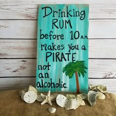 a sign that says drinking rum before 10am makes you a pirate not an alcoholic