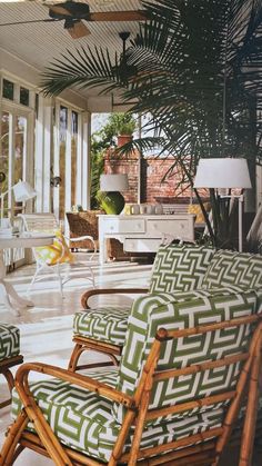 a living room filled with furniture and lots of windows