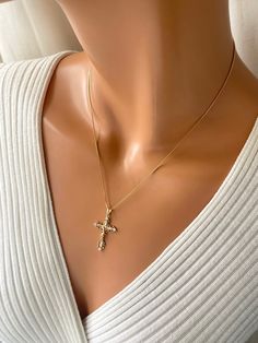 This is a 18kt gold-filled ornate crucifix cross pendant necklace.  Shown on a shiny 18kt gold filled box chain that measures 18" length.  his beautiful crucifix measures 35x20mm with bale. Please not that 18k gold filled is deeper in gold color, almost a pinkish gold.  Ships in a cute gift box ready to present. Gold filled jewelry is an actual layer of gold pressure bonded to another metal. Gold filled is not to be confused with gold plating as filled has 100% more gold than gold plating. Gold filled is much more valuable. Anyone that can wear gold, can wear gold filled jewelry without worries of an allergic reaction.  Gold-filled items are generally considered lifetime products and the gold layer will not wear off, as it will with gold-plated products. Fine Jewelry Cubic Zirconia Crucifix, Gold Cubic Zirconia Cross Pendant Necklace, Cubic Zirconia Crucifix Jewelry Gift, Gold Cubic Zirconia Crucifix Necklace, Gold Cross Necklace With Cubic Zirconia, Gold Cubic Zirconia Cross Necklace, Yellow Gold Cubic Zirconia Cross Jewelry, Yellow Gold Cubic Zirconia Cross Necklace, Gold Cubic Zirconia Pendant Cross Necklace