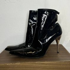 Versace Black Patent Leather Heels These Booties Are Killer!!! I Did Some Research & Can't Find Another Pair! Super Unique, Sexy & Edgy! Best Guess At Age Is 2010s Condition- Few Scuffs On Bottom Soles And Couple Tiny Scratches On Heel Insole- 9.5" Toebox- 3" Heel- 4" Total Height- 9" Elegant Shiny Black Boots For Evening, Elegant Shiny Black Evening Boots, Elegant Shiny Boots For Formal Occasions, Elegant Shiny Formal Boots, Elegant Formal Shiny Boots, Metallic High Heel Boots For Formal Occasions, Versace Shoes, Patent Leather Heels, Black Patent Leather