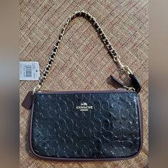 Measures 7.5” Wide X 4.5” High X 2” Deep. Strap Has A 6.5” Drop. In New Condition Coach Black Bag With Zipper Pouch, Black Coach Bag With Zipper Pouch, Coach Evening Pouch Clutch, Coach Wristlet, Black Patent Leather, Coach Bags, Purple And Black, Patent Leather, Mini Bag