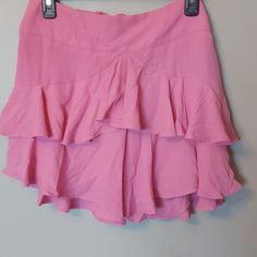 Nwt Express Ruffled Skirt Size 10 Sooo Cute Ladies! I Purchased & Didn't Need It Was Bought 01/21. It Is Pink With Three Layers Of Ruffles Very Soft Lightweight With A Type Of Satin Layer Underneath. Zip Partial In The Back With A Hook & Eye Closure As Pictured. Bow In The Back As Well! High Waist Ruffled Skort, Ruffled Short Skirt For Day Out, Short Ruffled Skirt For Day Out, Flowy Ruffled Mini Skirt, Short Length Ruffled Relaxed Skirt, High Waist Relaxed Mini Skirt With Ruffles, High Waist Mini Skirt With Ruffles, High Waist Ruffled Mini Skirt, Ruffle Hem Flared Skort