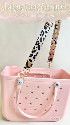 a pink bag with leopard print straps hanging from it's handle and the words boog bag strap