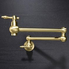 This wall-mounted pot filler offers a convenient way to fill large pots without the hassle of moving heavy cookware. The swivel spout provides extended reach for added convenience in the kitchen. KISRAIS Finish: Gold | KISRAIS Faucet Wall Mount Pot Filler 2.65 H in yellow in Gold | 20.68" | Wayfair Pot Fillers Over Stove, Gold Pot Filler, Brass Pot Filler, Pot Fillers, Wall Mount Kitchen Faucet, Pot Filler Kitchen, Brass Pot, Pot Filler Faucet, Pot Filler