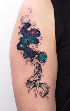 a woman's arm with an abstract tattoo design on the left side of her body